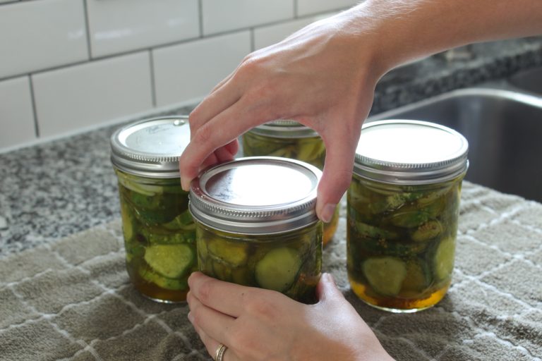 Tightening bands on jars of bread and butter pickles