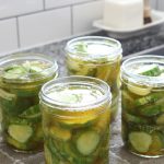 4 pints of bread and butter pickles filled and ready for canning