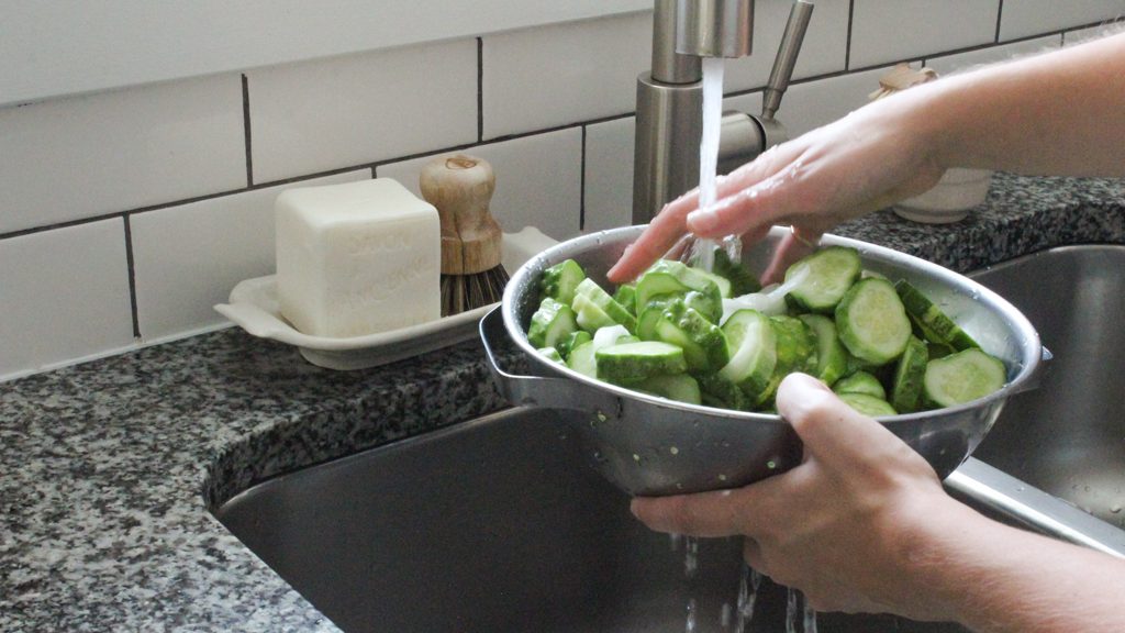 Rinsing salt off of cucumbers and onions for bread and butter pickles