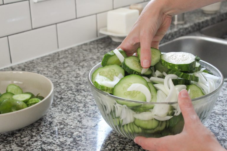 Mixing cucumbers and onions for bread and butter pickles canning recipe