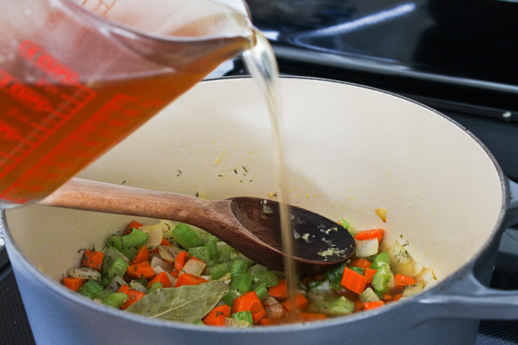 Adding broth to Chicken Pot Pie soup