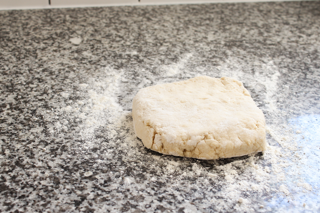 Rolling out homemade biscuits dough