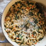 Overhead shot of One Pot Pasta with Sausage and Kale in dutch oven