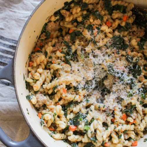 Overhead shot of One Pot Pasta with Sausage and Kale in dutch oven