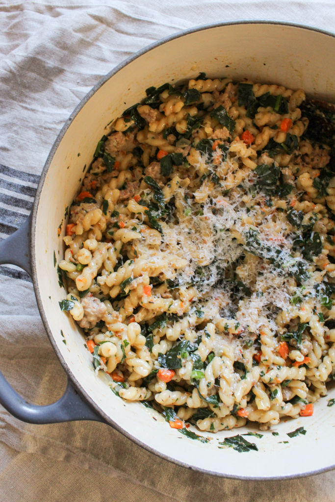 Overhead shot of One Pot Pasta with Sausage and Kale in dutch oven