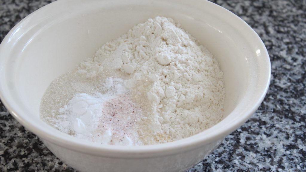 mixing dry ingredients for homemade cornbread recipe