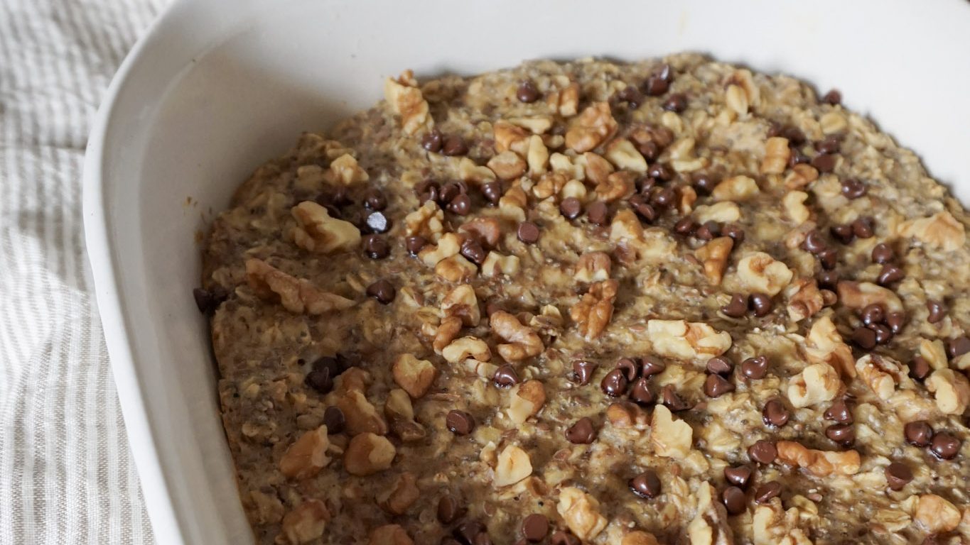 Freshly baked banana oatmeal in a ceramic baking dish