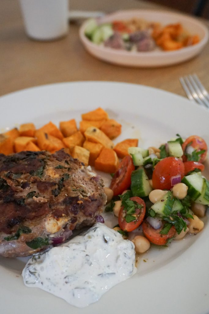 Plate with greek turkey burger, chickpea salad, and sweet potatoes for a quick lunch for busy moms and toddlers