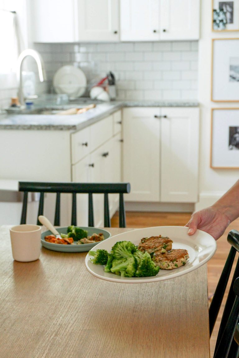 Setting down plate of easy salmon cakes for lunch for busy moms