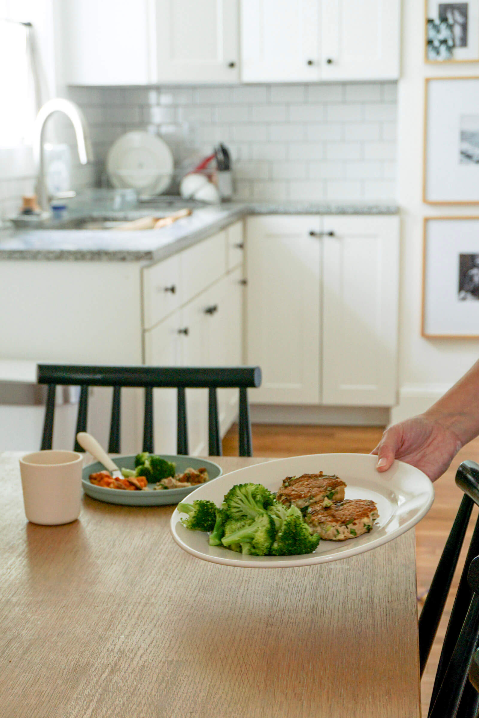 Setting down plate of easy salmon cakes for lunch for busy moms
