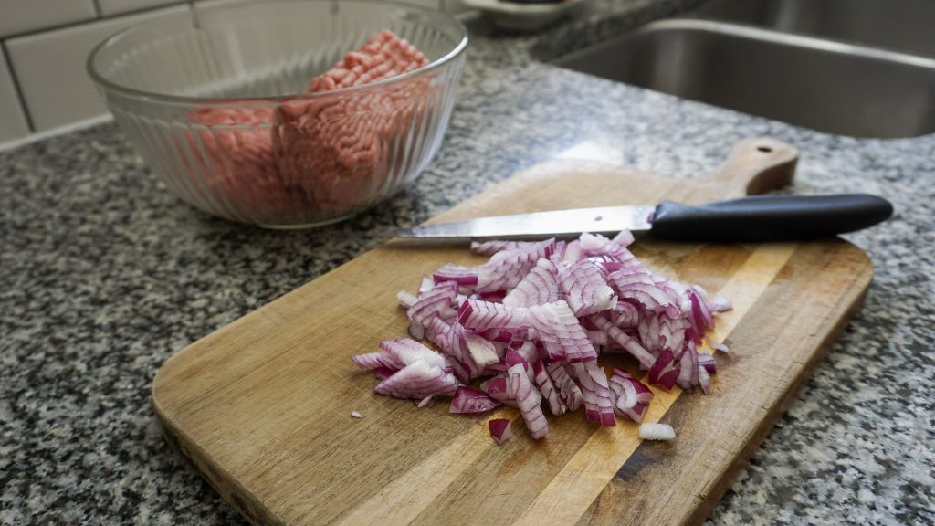Red onions ready to be added to Greek turkey burgers