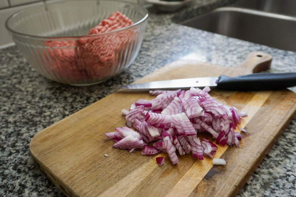 Red onions ready to be added to Greek turkey burgers