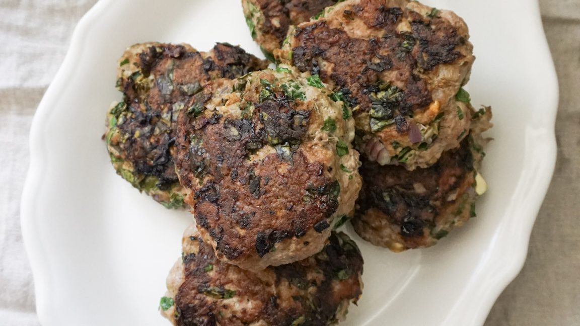Healthy Greek turkey burger with feta served on a plate