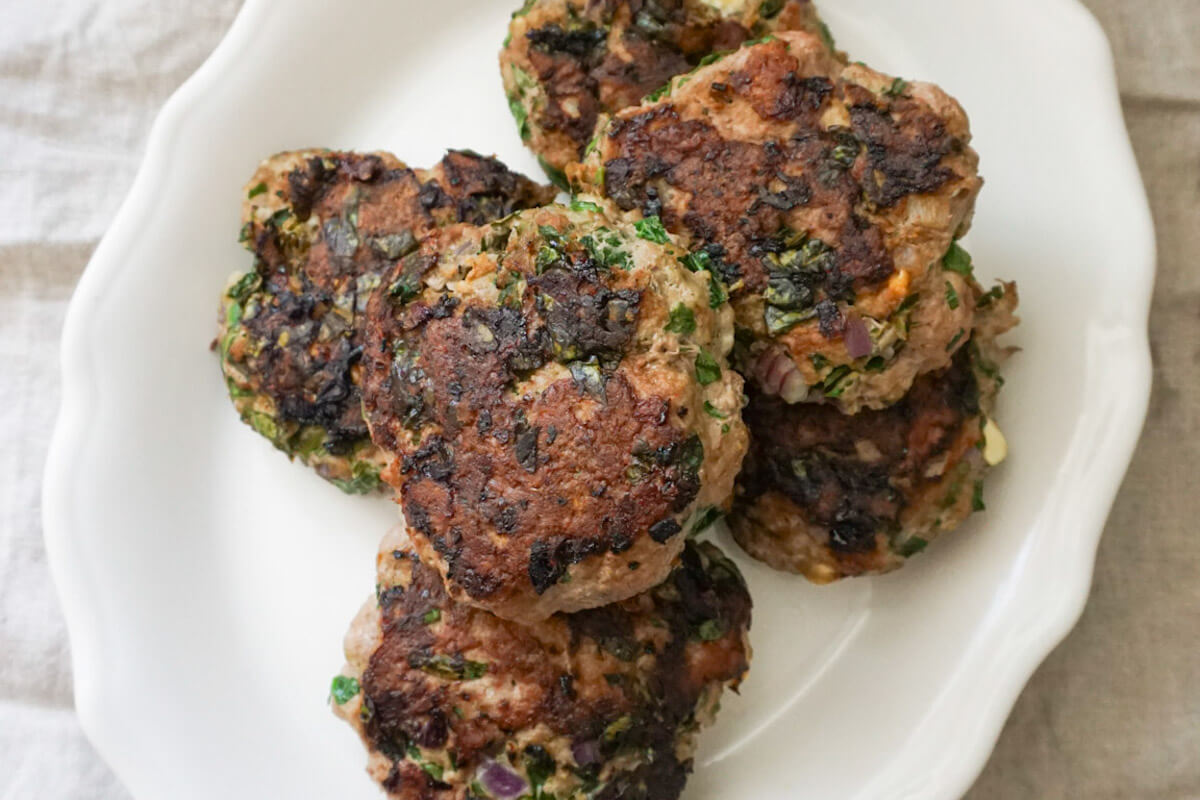 Healthy Greek turkey burger with feta served on a plate