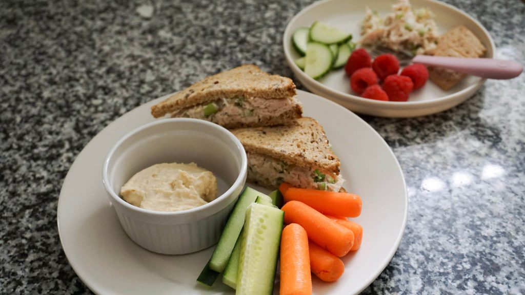 Chicken salad sandwich on a plate for a quick lunch for busy moms and toddlers