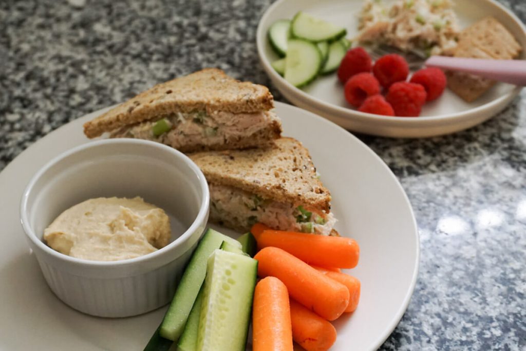 Chicken salad sandwich on a plate for a quick lunch for busy moms and toddlers