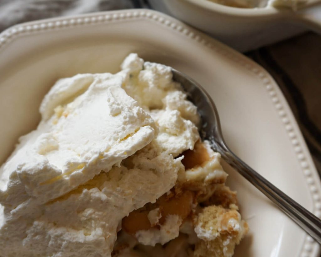 Zoomed in shot of bowl of homemade banana pudding made without instant pudding mix