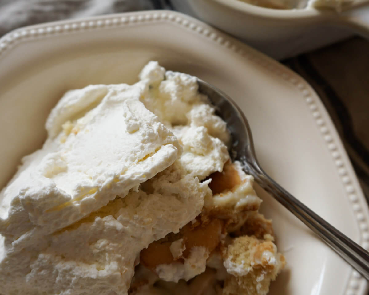 Zoomed in shot of bowl of homemade banana pudding made without instant pudding mix