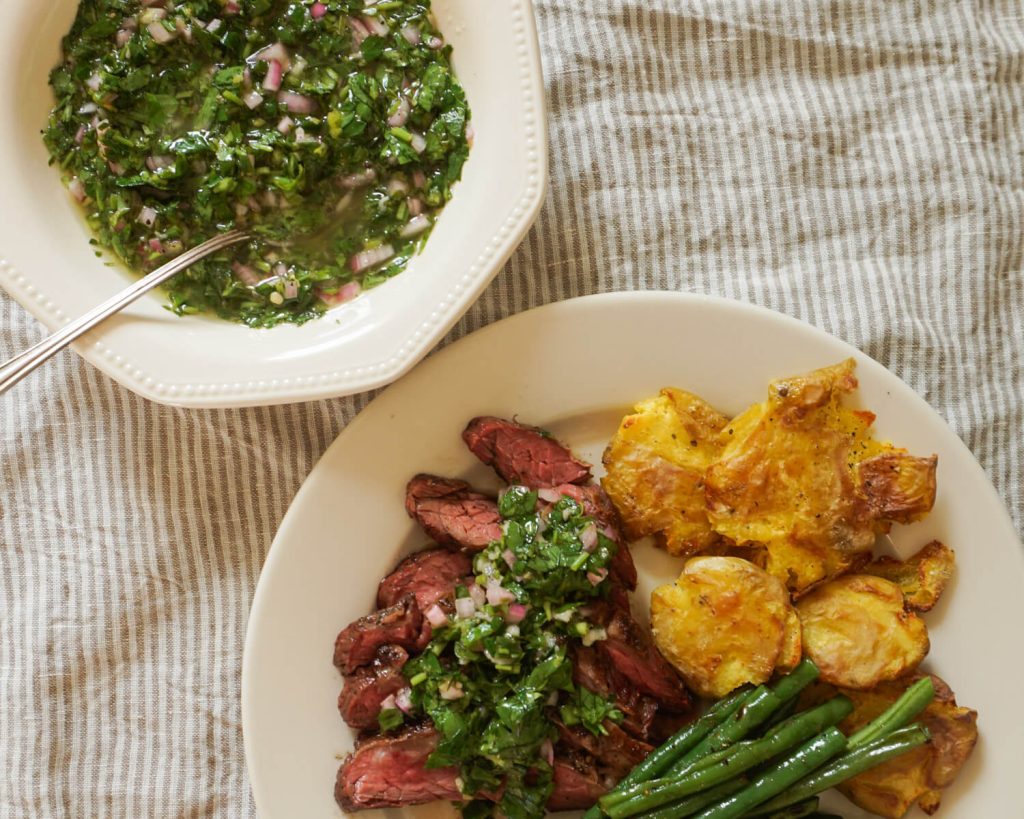 Grilled steak with chimichurri sauce dinner