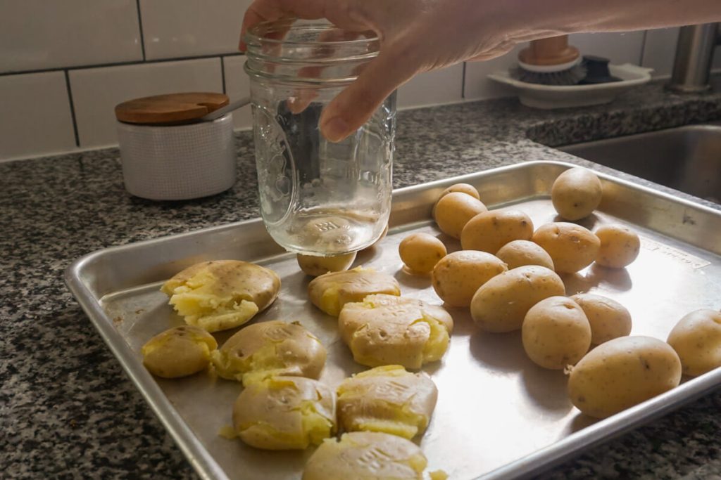 Smashing baby potatoes for crispy smashed potatoes side dish