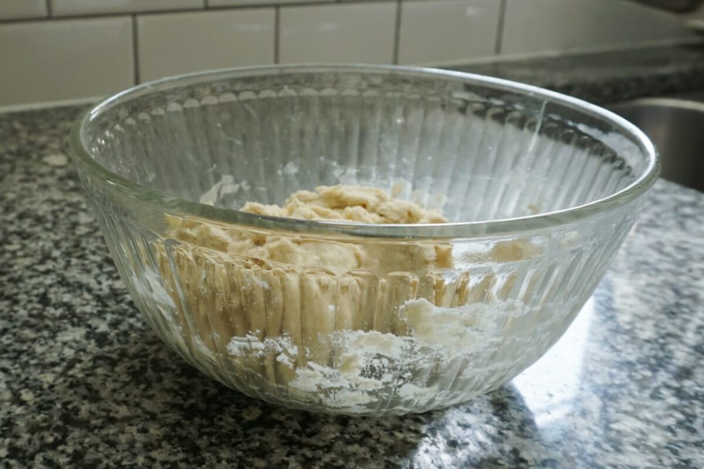 bringing homemade crust together with ice cold water