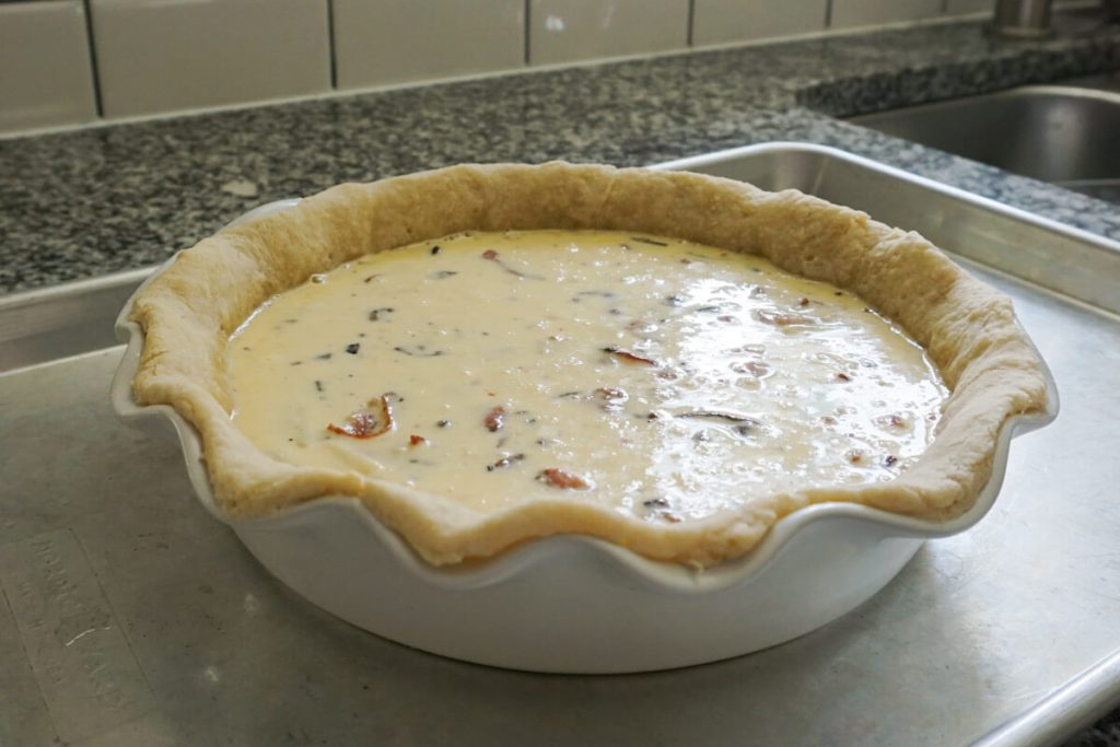 Quiche with simple cheese and bacon filling
