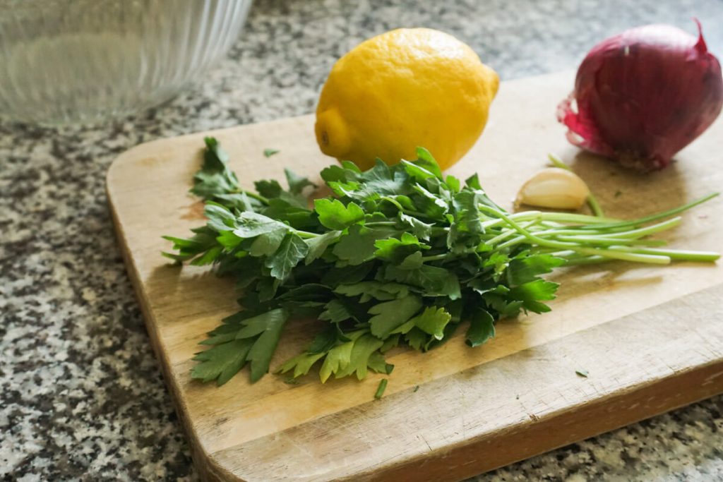 ingredients on chopping board for chickpea cucumber salad
