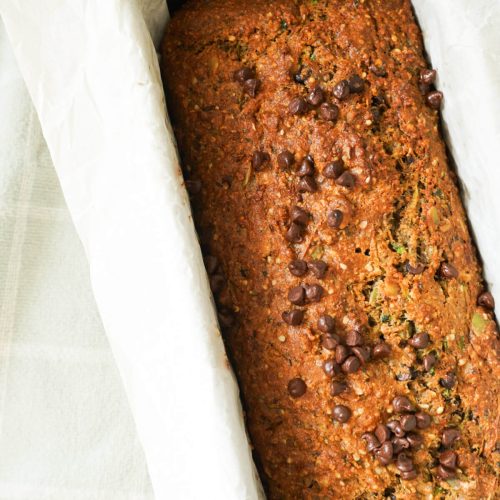 overhead shot of chocolate chip zucchini bread with Greek yogurt baked in a loaf pan