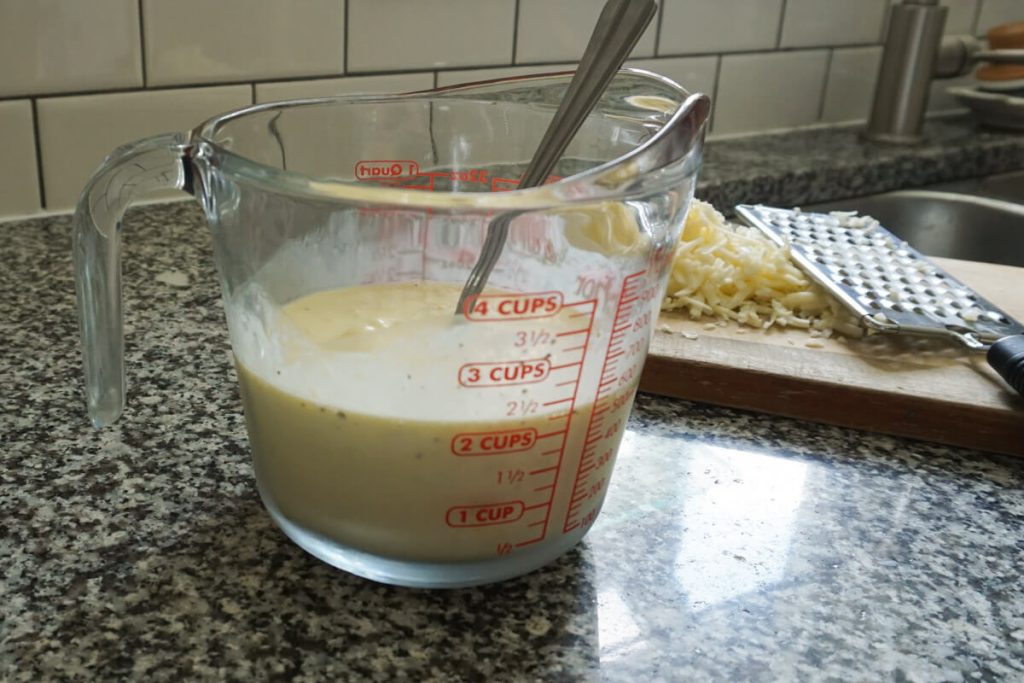Measuring cup with basic quiche filling