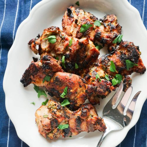 easy greek chicken thighs on platter