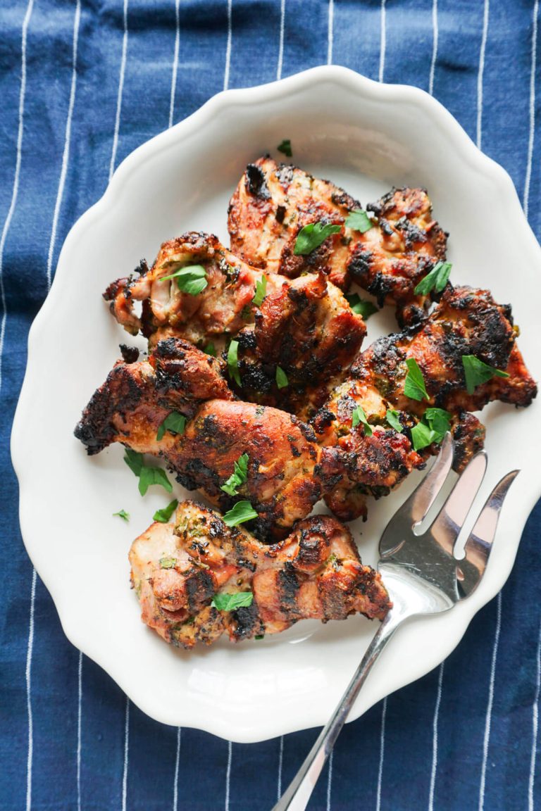 easy greek chicken thighs on platter