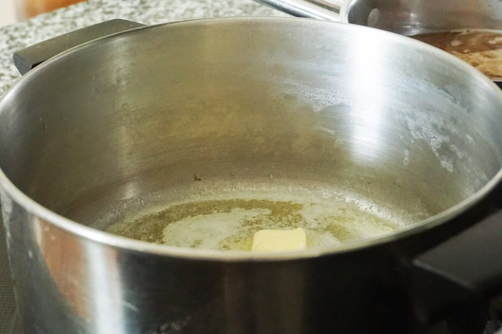melting butter in large pot for easy stovetop Mac and cheese