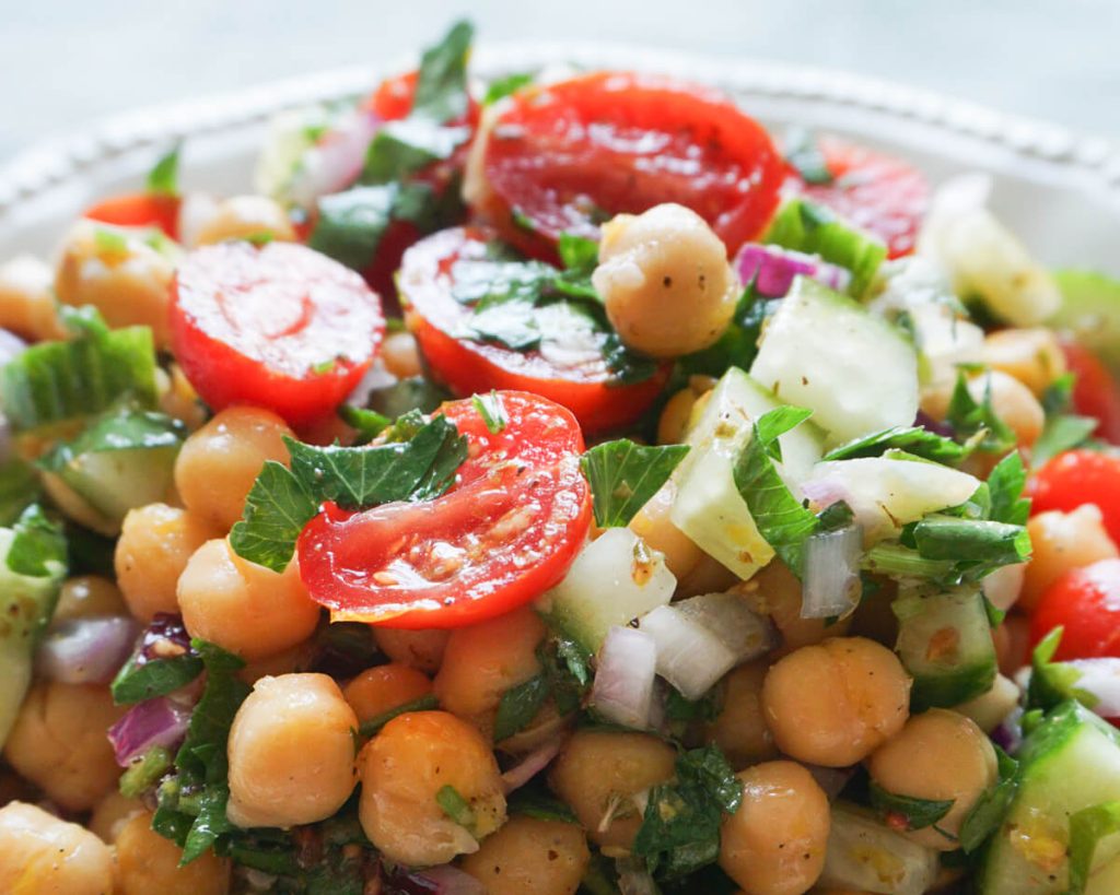close up of chickpea cucumber salad in bowl for healthy summer side idea