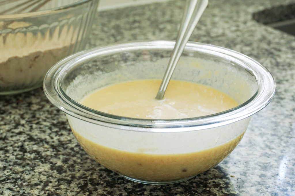 mixing wet ingredients for healthy chocolate chip zucchini bread